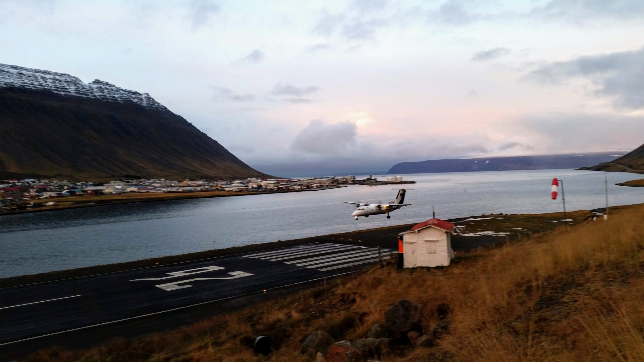 Airplane landing at Isafjordur airport.
