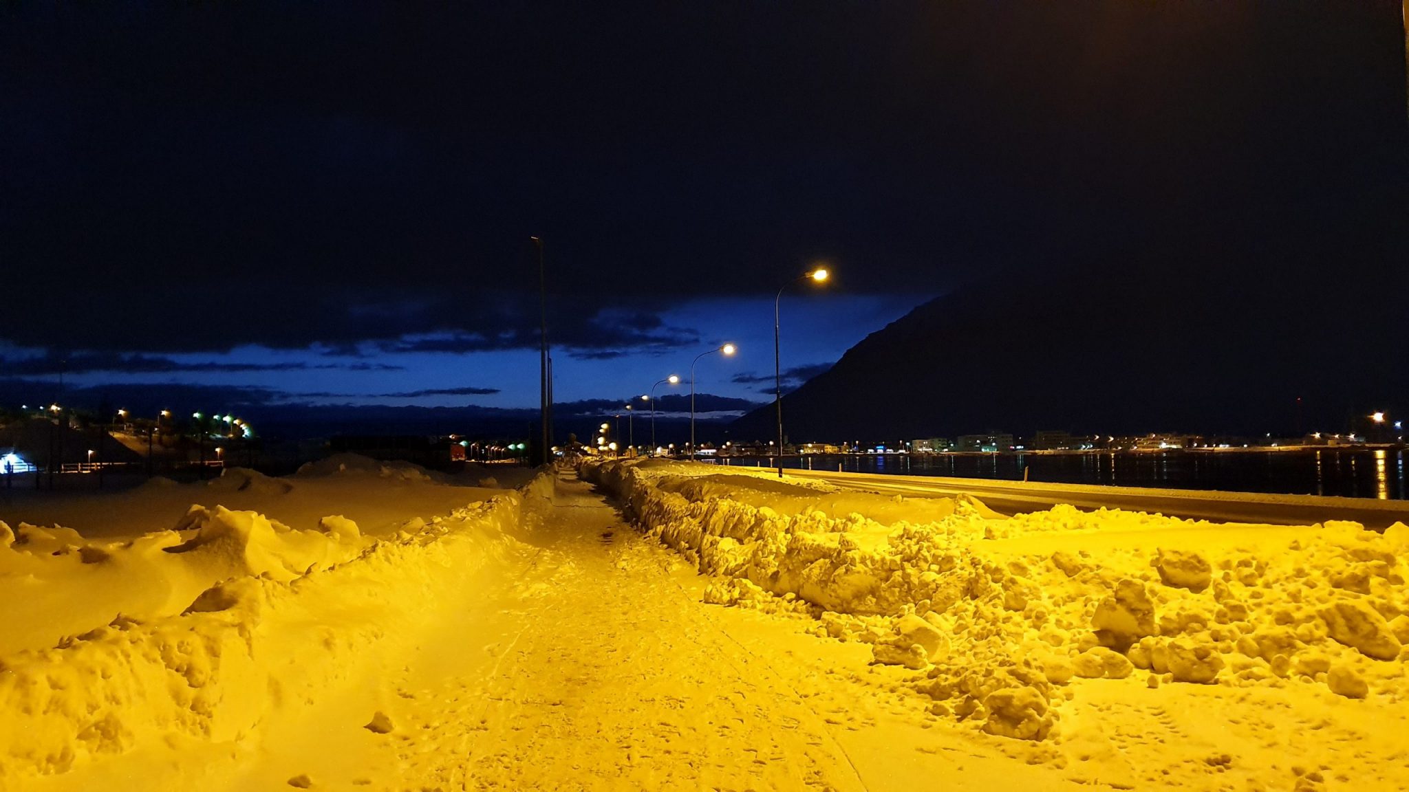 Piles Of Snow In Isafjordur Town