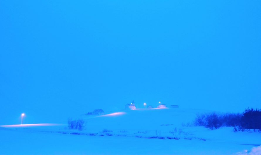Distant Church Lights In Snow Storm